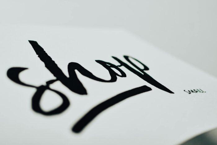 Close-up of a handwritten sign promoting support for small businesses.